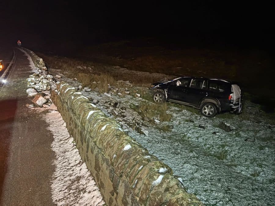 An A.O Recovery job at night, an SUV recovered off-road in the snow